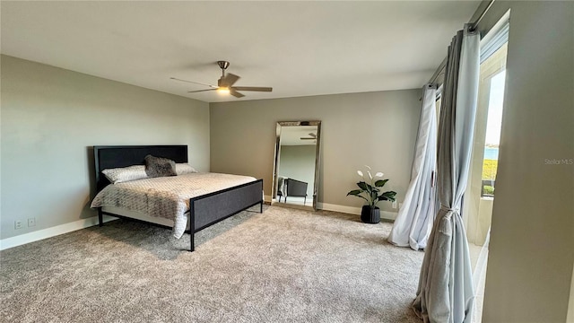 carpeted bedroom featuring ceiling fan and multiple windows