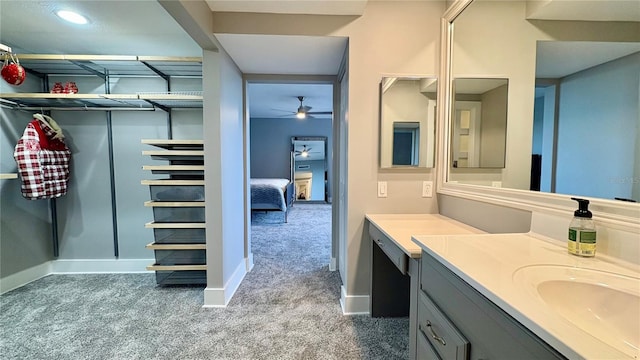 bathroom featuring ceiling fan and vanity