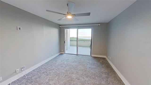 unfurnished room with carpet flooring and ceiling fan