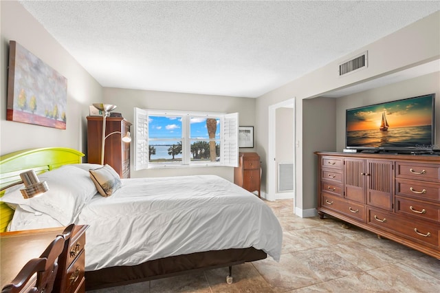 bedroom featuring a textured ceiling