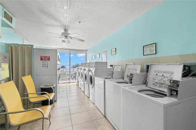 laundry area featuring light tile patterned floors, a textured ceiling, ceiling fan, and separate washer and dryer