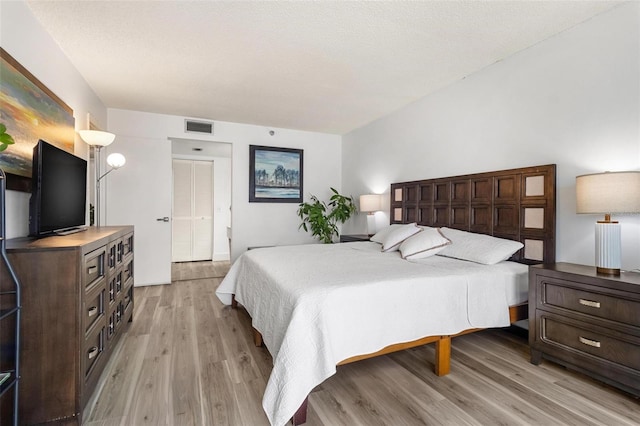 bedroom with light hardwood / wood-style floors