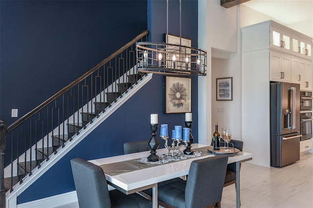 tiled dining space with beam ceiling