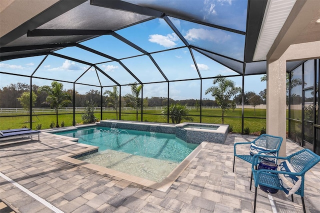 view of pool featuring an in ground hot tub, a yard, a patio, and glass enclosure