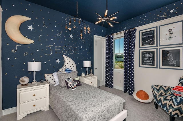 bedroom featuring carpet floors and a notable chandelier