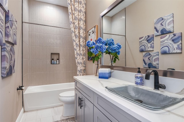 full bathroom featuring tile patterned flooring, vanity, toilet, and tiled shower / bath