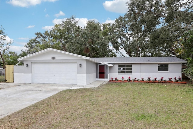 ranch-style home with a front yard and a garage