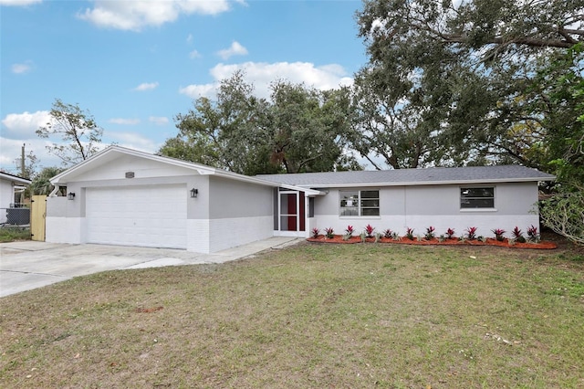 single story home featuring a front yard and a garage