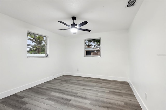 spare room featuring ceiling fan and hardwood / wood-style flooring