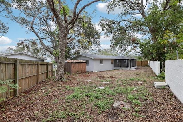 view of yard featuring a sunroom