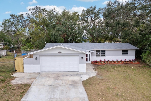 ranch-style house with a front lawn and a garage