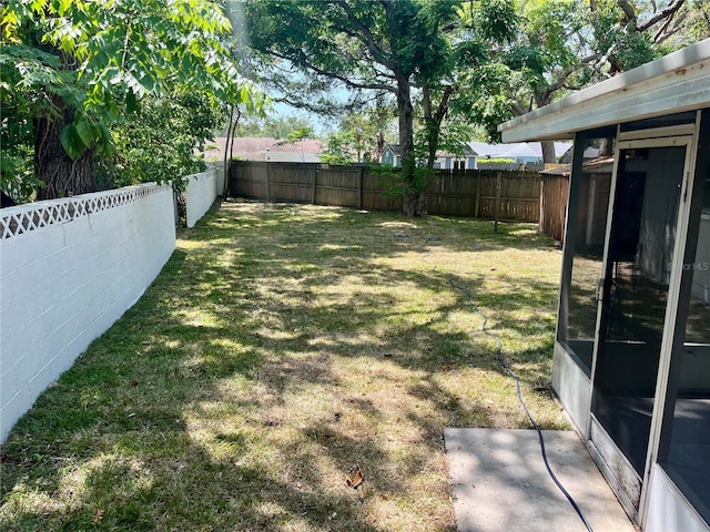 view of yard with a fenced backyard