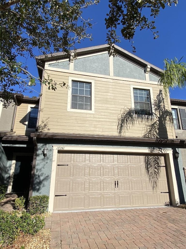 view of side of home featuring a garage