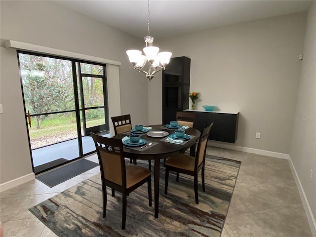 dining room with light tile patterned flooring and a chandelier