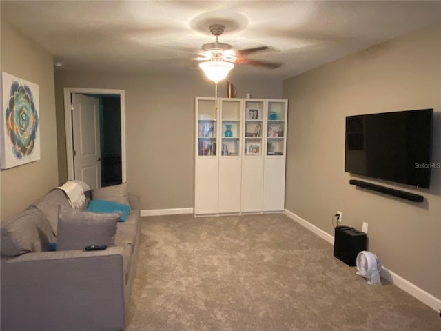 living room featuring ceiling fan and carpet floors