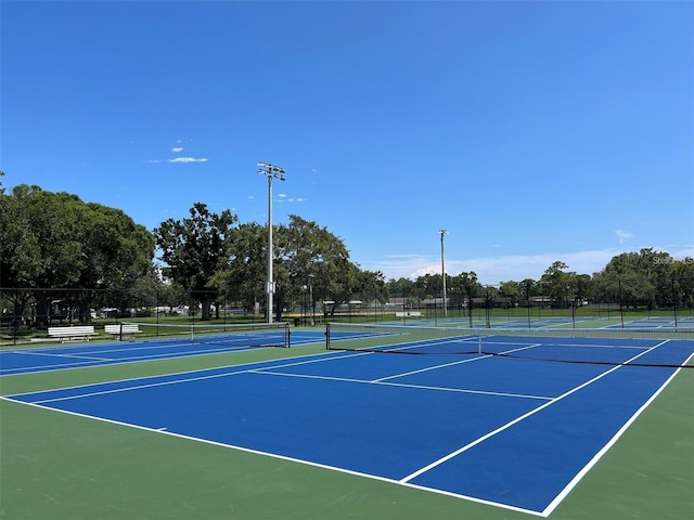 view of sport court featuring basketball hoop