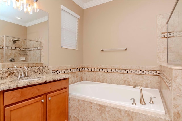 bathroom with vanity, ornamental molding, and independent shower and bath