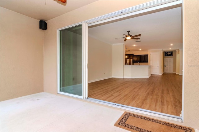 interior space with ceiling fan