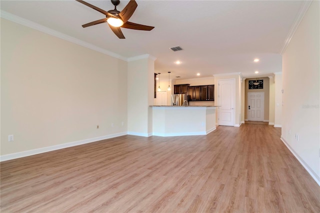 unfurnished living room with ceiling fan, ornamental molding, and light hardwood / wood-style floors