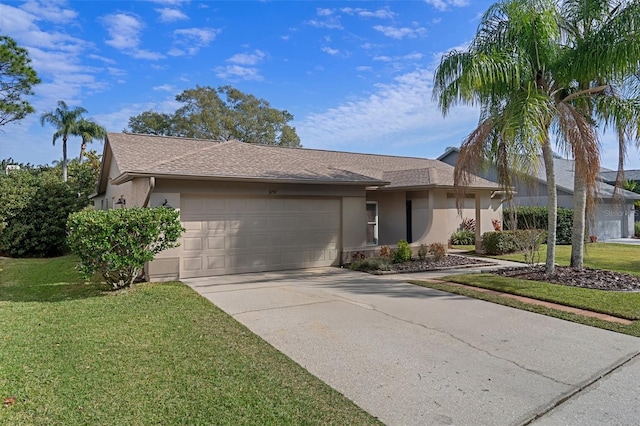 ranch-style home featuring a front lawn and a garage