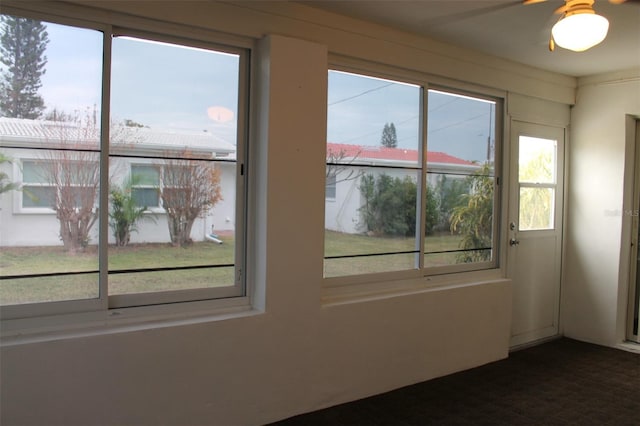 interior space featuring ceiling fan