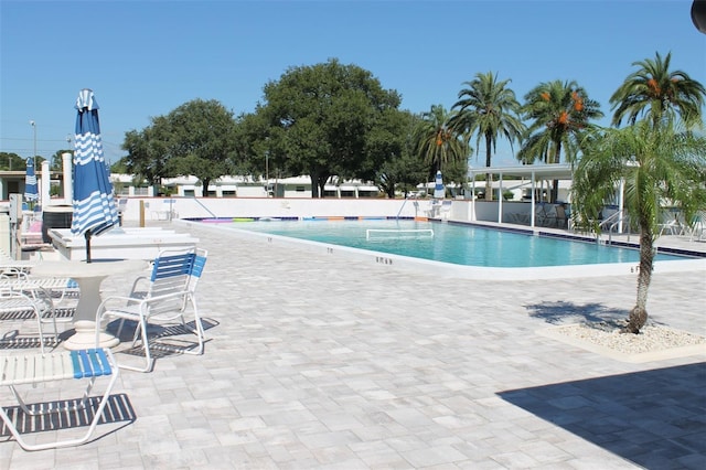 view of swimming pool with a patio area