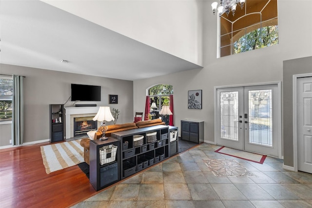 foyer featuring french doors and an inviting chandelier