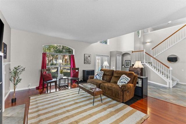 living room featuring french doors and hardwood / wood-style flooring