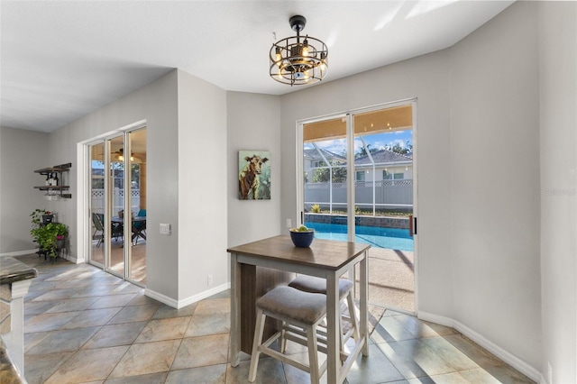 dining space with a notable chandelier