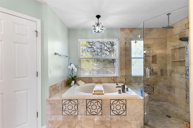 bathroom with an inviting chandelier and plus walk in shower