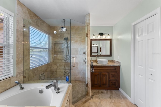 bathroom with independent shower and bath and vanity