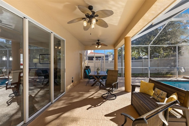 view of patio / terrace with ceiling fan, a fenced in pool, glass enclosure, and an outdoor living space