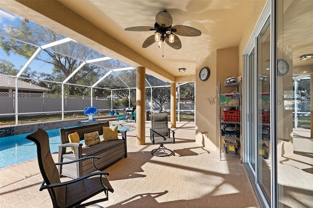 view of patio featuring a fenced in pool, an outdoor hangout area, and glass enclosure