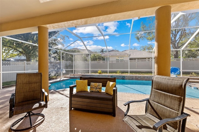 view of swimming pool with a lanai and a patio