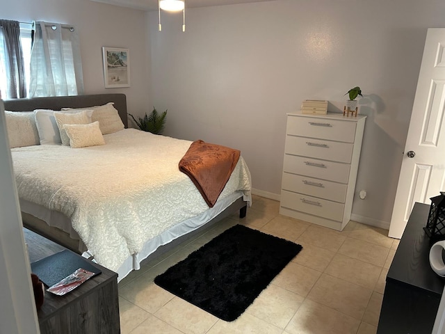 bedroom featuring light tile patterned flooring