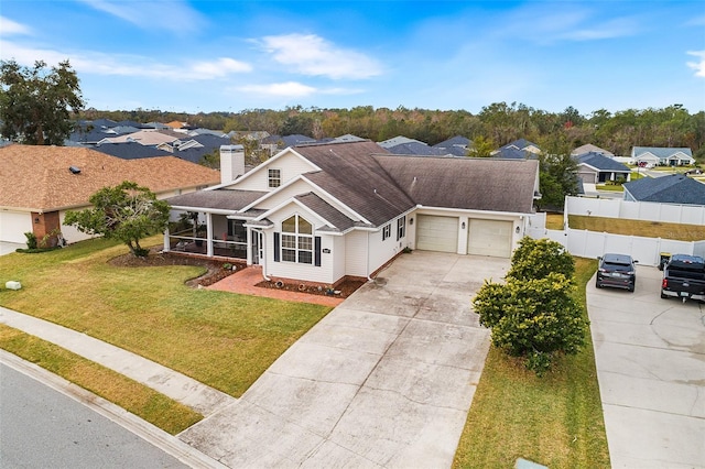 birds eye view of property with a residential view