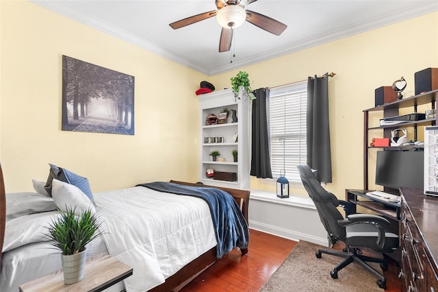 bedroom featuring ceiling fan, baseboards, wood finished floors, and ornamental molding