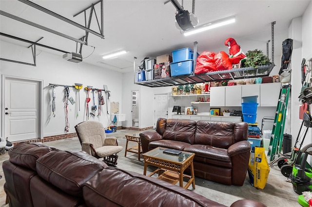 living room with concrete flooring and a garage