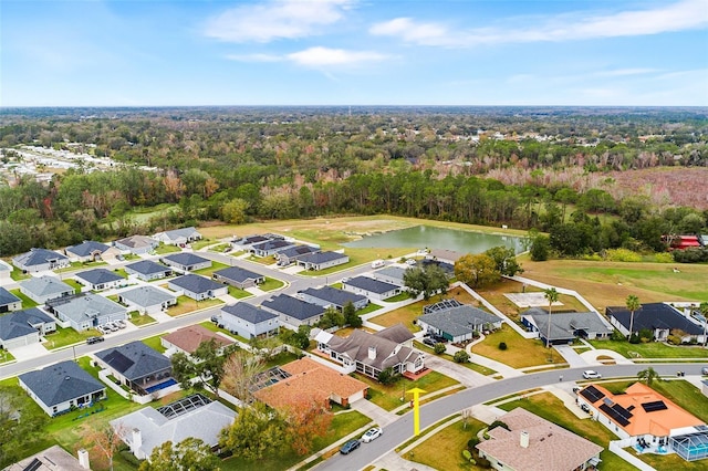 bird's eye view featuring a water view and a residential view