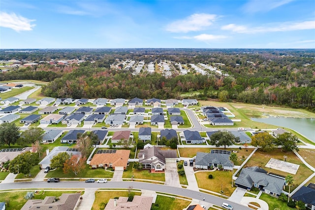 bird's eye view featuring a residential view and a water view