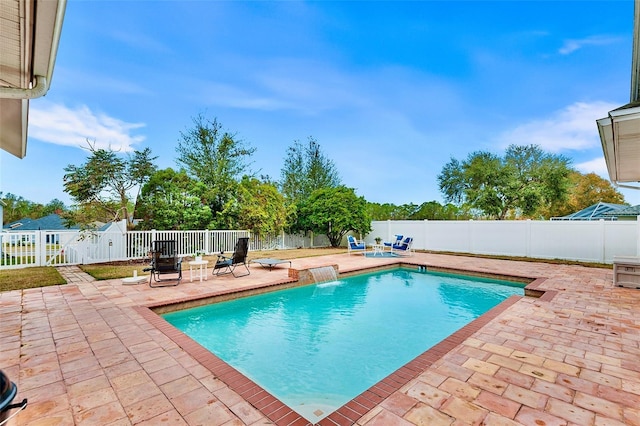 view of pool featuring a patio area, a fenced in pool, and a fenced backyard