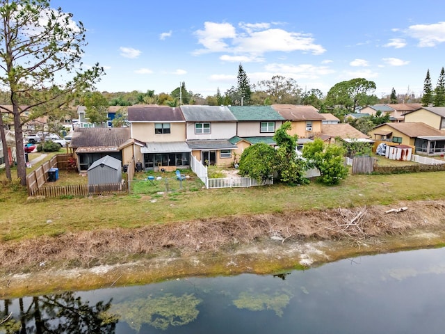 back of house featuring a water view