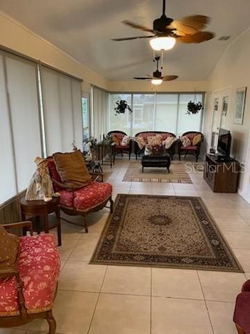 sunroom featuring ceiling fan and vaulted ceiling