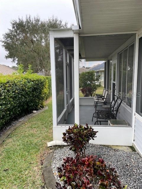 view of patio with a sunroom