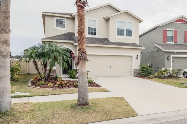 view of front of house featuring a garage and a front yard