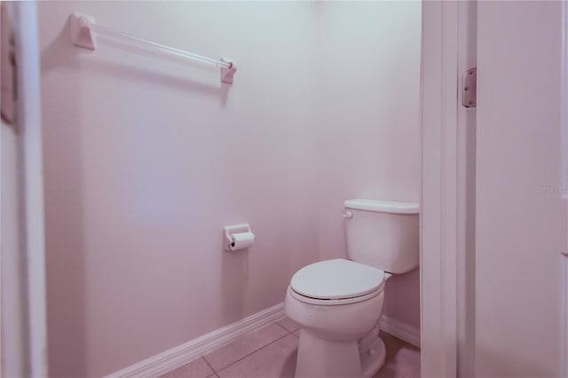 bathroom featuring toilet and tile patterned floors