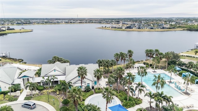 birds eye view of property with a water view