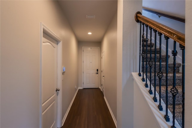 corridor featuring dark hardwood / wood-style floors