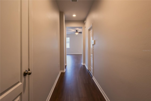 hall with dark hardwood / wood-style flooring