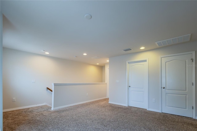 empty room featuring carpet floors